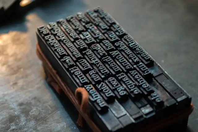 A block of letterpress type, inked and set
